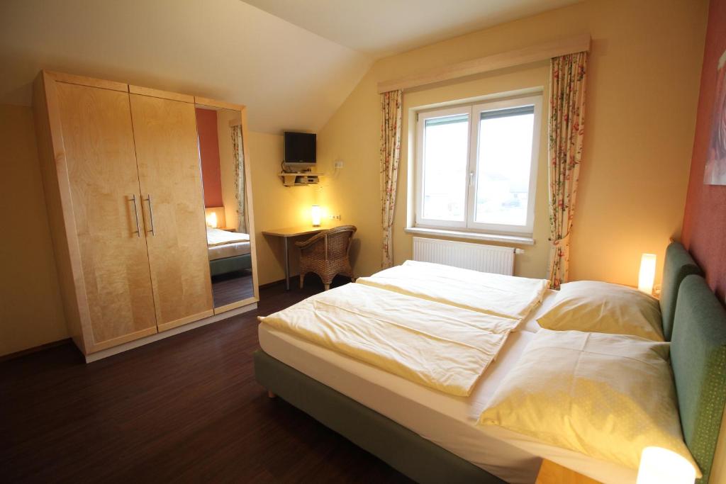 Postel nebo postele na pokoji v ubytování Rosenhotel - Serviced Apartments