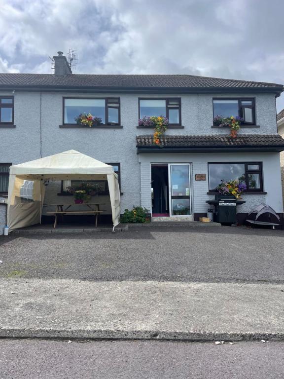 a white tent in front of a house at Bru Na Pairc B&B in Bantry