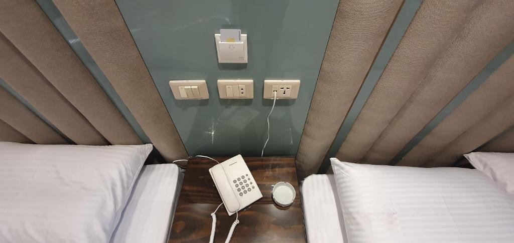 Postel nebo postele na pokoji v ubytování Grand Bayan Hotel & Apt at Nile Plaza