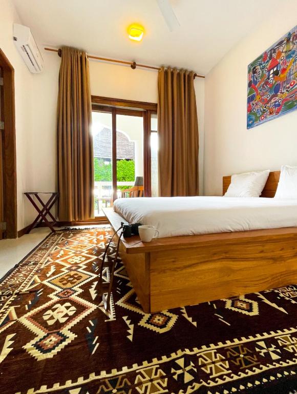 Postel nebo postele na pokoji v ubytování Oxygen Paje Hotel
