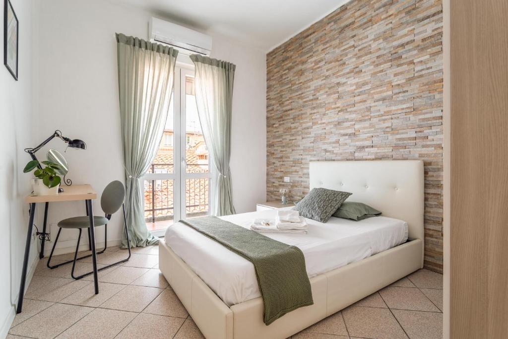 En eller flere senge i et værelse på “Sui tetti di Pietra” Appartamento Centro Storico