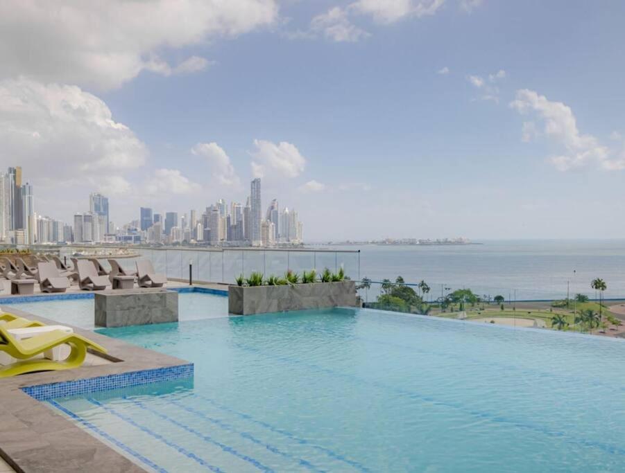 a swimming pool with a view of the city at Luxury living and Pacific Views in Panama City