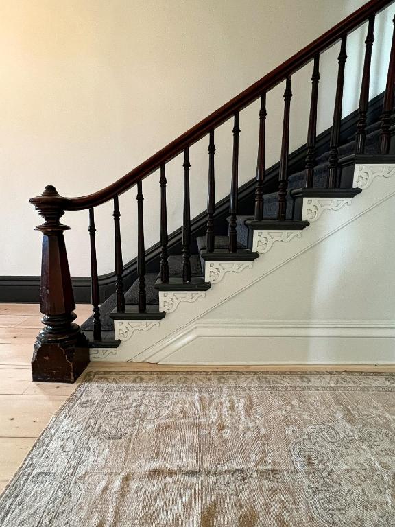 an image of a staircase with a carpet at The August House in Windsor