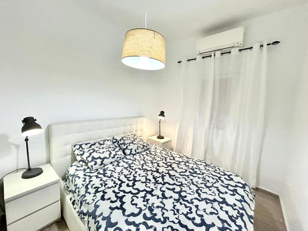 Postel nebo postele na pokoji v ubytování Centro Ronda de Segovia Aparment