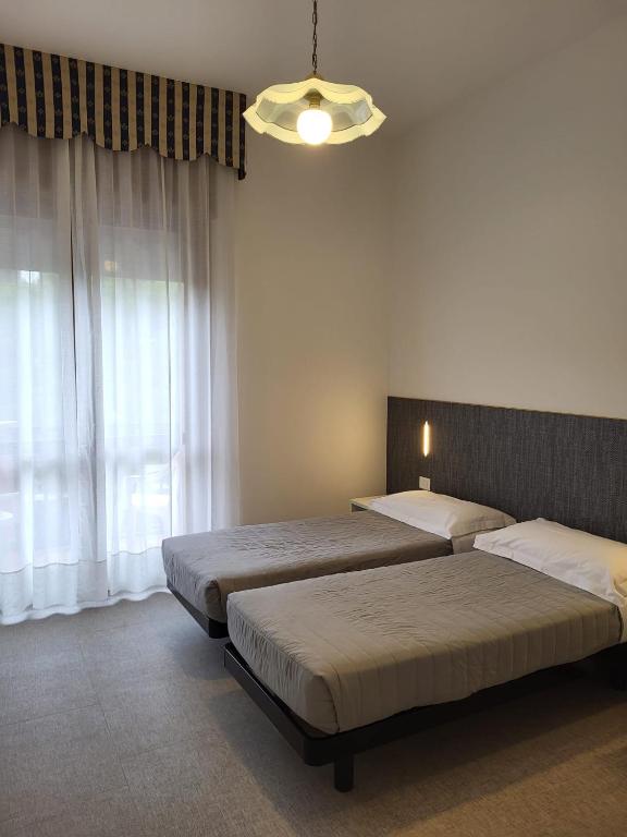 Postel nebo postele na pokoji v ubytování Hotel Piccadilly
