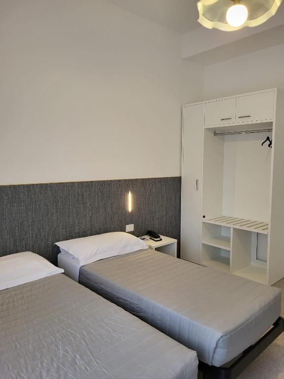 Postel nebo postele na pokoji v ubytování Hotel Piccadilly