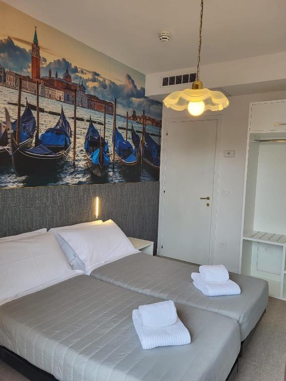 Postel nebo postele na pokoji v ubytování Hotel Piccadilly