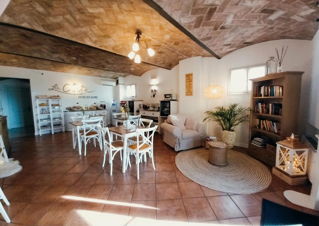 a living room with a couch and a table at La Corte Country Rooms in Modena