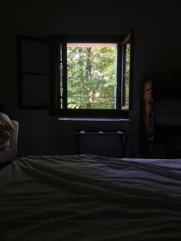 Postel nebo postele na pokoji v ubytování Agriturismo Barchessa