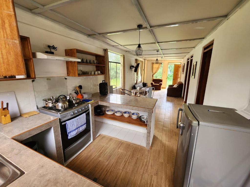 an aerial view of a kitchen in a tiny house at Casita Campestre Pitusiray in Calca