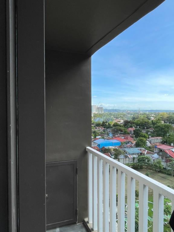 a balcony with a view of a city at Condotel810byWVtowers1&2 in Iloilo City