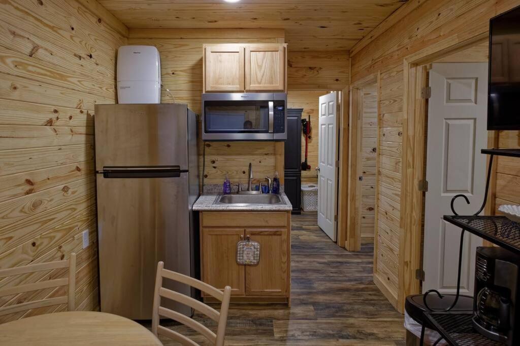 a kitchen with a refrigerator and a sink at The Lodge at Welch in Welch