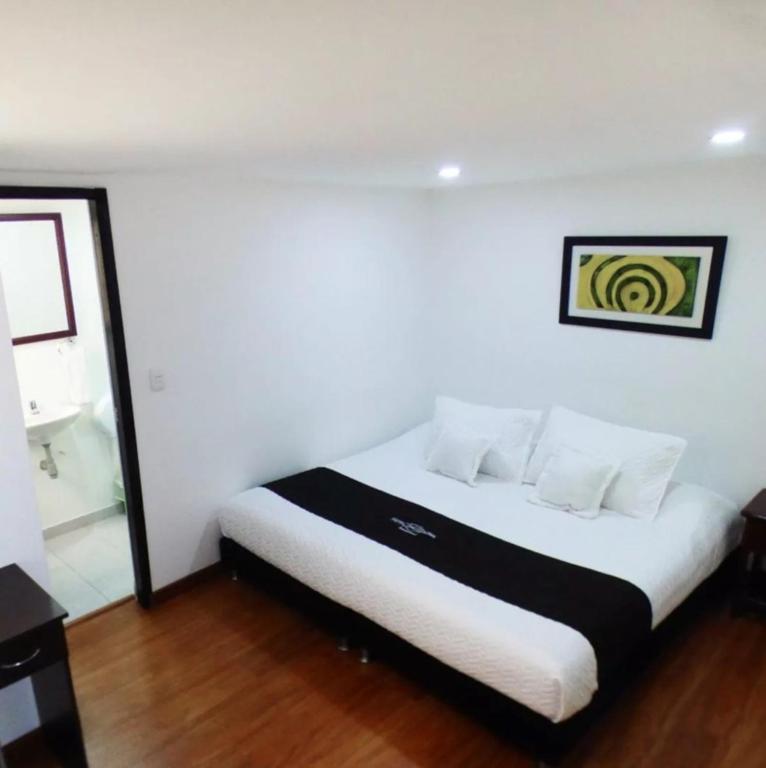 Postel nebo postele na pokoji v ubytování Hotel Colonial Internacional