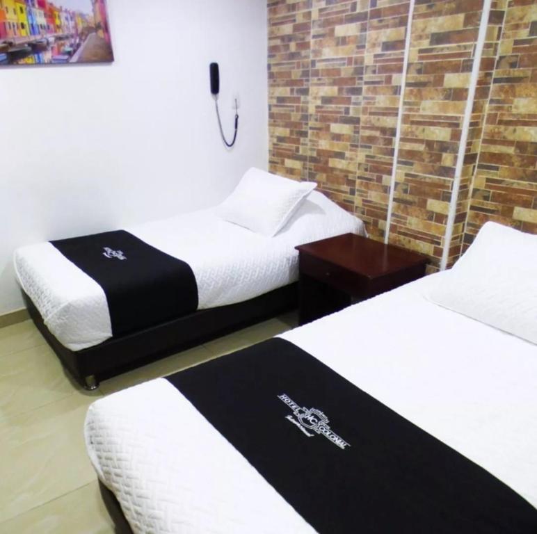 Postel nebo postele na pokoji v ubytování Hotel Colonial Internacional