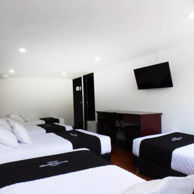 Postel nebo postele na pokoji v ubytování Hotel Colonial Internacional