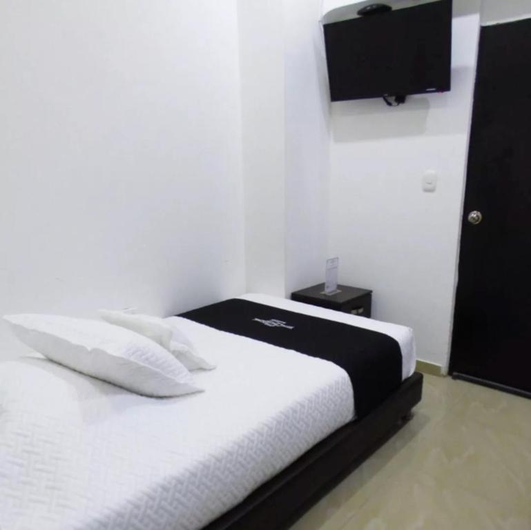 Postel nebo postele na pokoji v ubytování Hotel Colonial Internacional