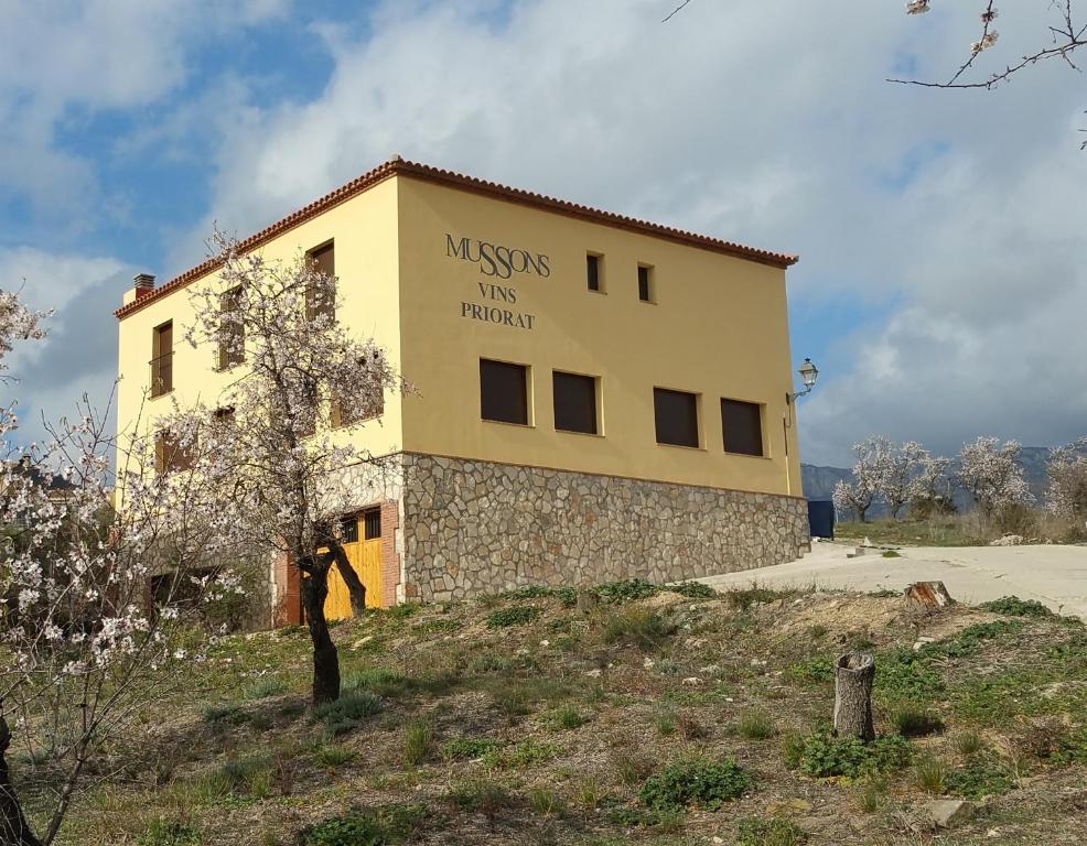 a building with a sign on the side of it at Hostal Restaurant Mussons Vins in Poboleda