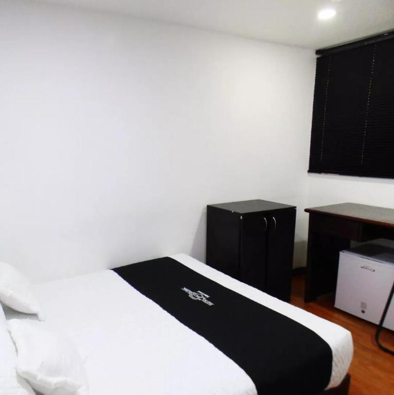 Postel nebo postele na pokoji v ubytování Hotel Colonial Internacional
