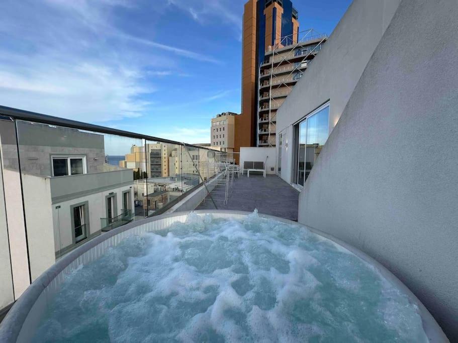 The swimming pool at or close to Paceville Sea view Penthouse with Jacuzzi!