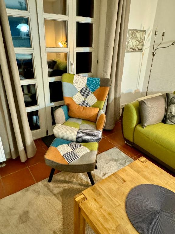 Posezení v ubytování Möwenblick Bakenberg-41 Ferienwohnung mit Terrasse, Doppelbett, Schlafsofa, vollständige Komfortküche