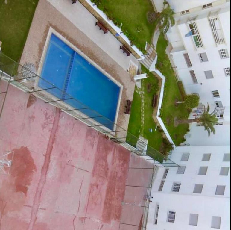 an overhead view of a building with a blue window at Apartamento exclusivo in Tangier