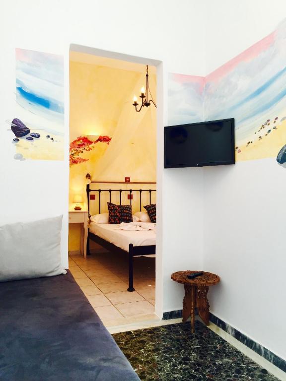 Postel nebo postele na pokoji v ubytování Aphrodite Boutique Hotel