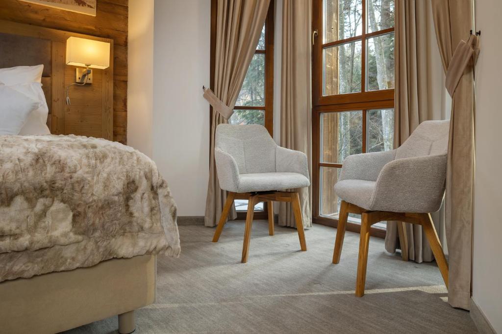 Postel nebo postele na pokoji v ubytování Chalet Royal