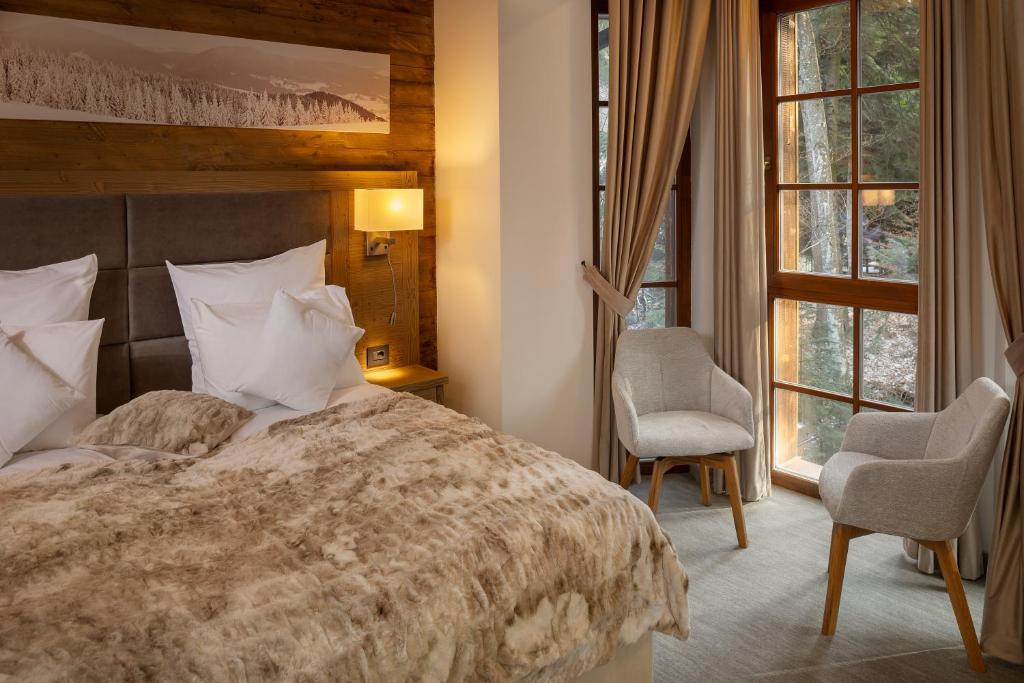 Postel nebo postele na pokoji v ubytování Chalet Royal