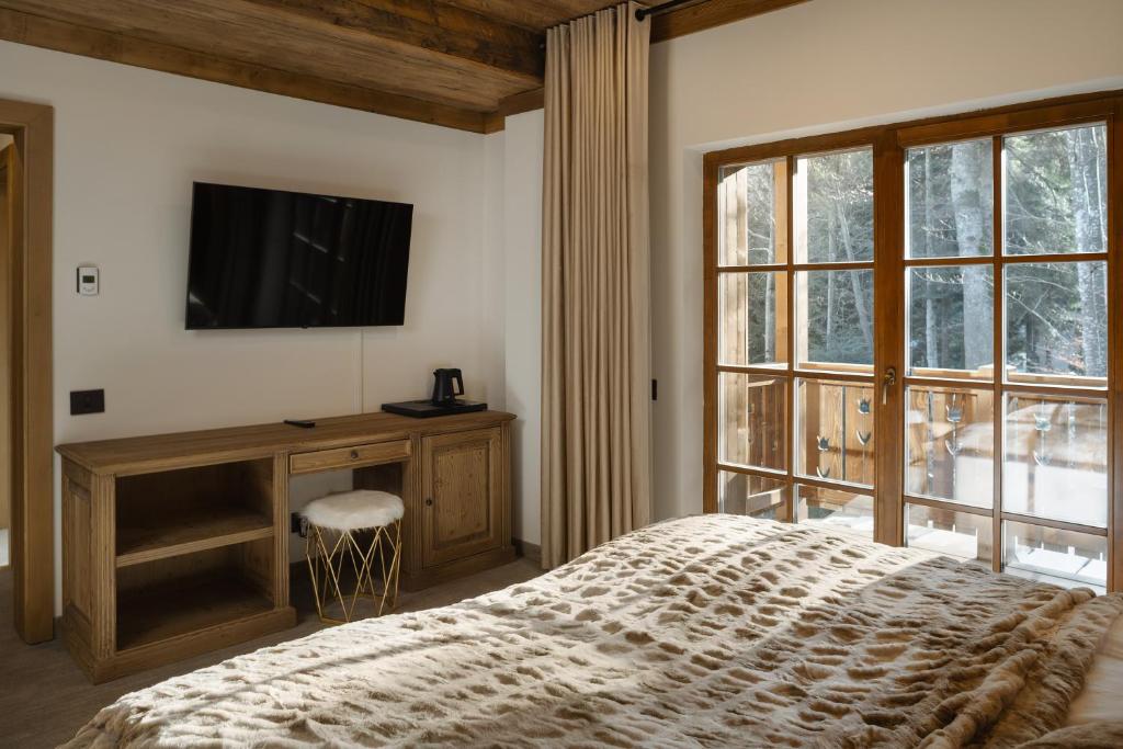 Postel nebo postele na pokoji v ubytování Chalet Royal