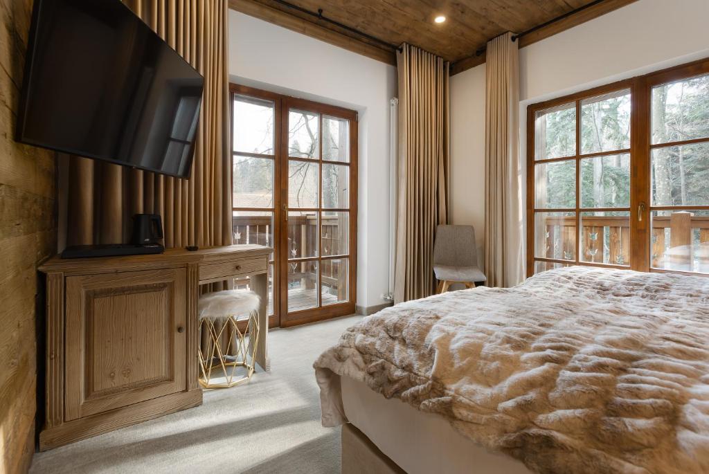 Postel nebo postele na pokoji v ubytování Chalet Royal