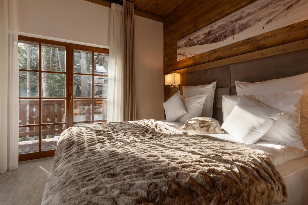 Postel nebo postele na pokoji v ubytování Chalet Royal