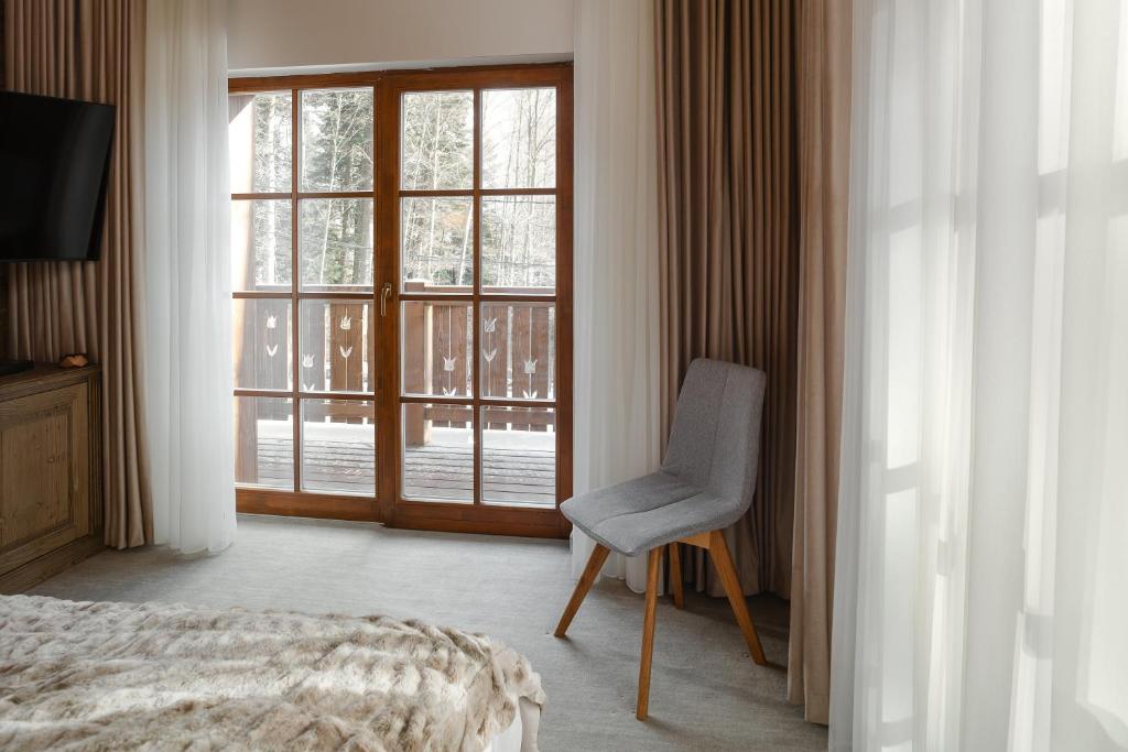 Postel nebo postele na pokoji v ubytování Chalet Royal