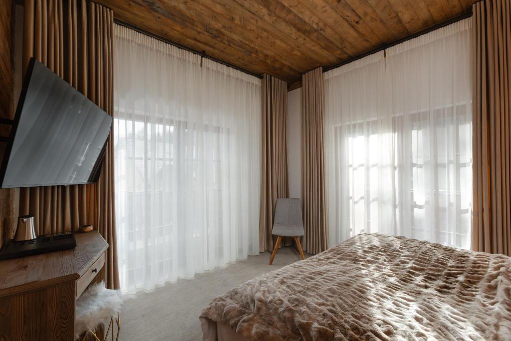TV a/nebo společenská místnost v ubytování Chalet Royal