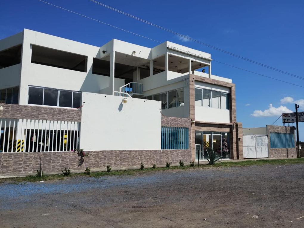 a building with a sign in front of it at VILLAS VICENCIO in Veracruz