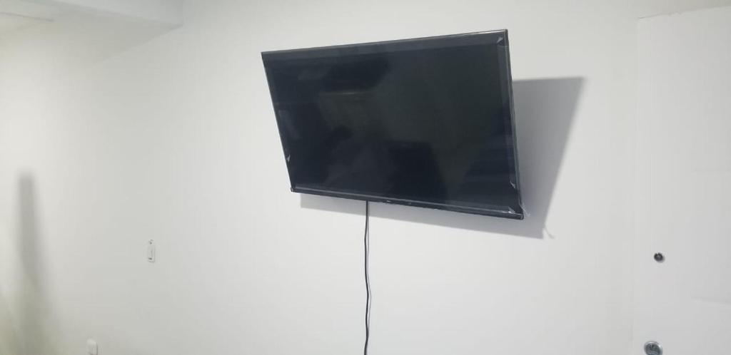 TV a/nebo společenská místnost v ubytování Habitación de Lujo para Pareja