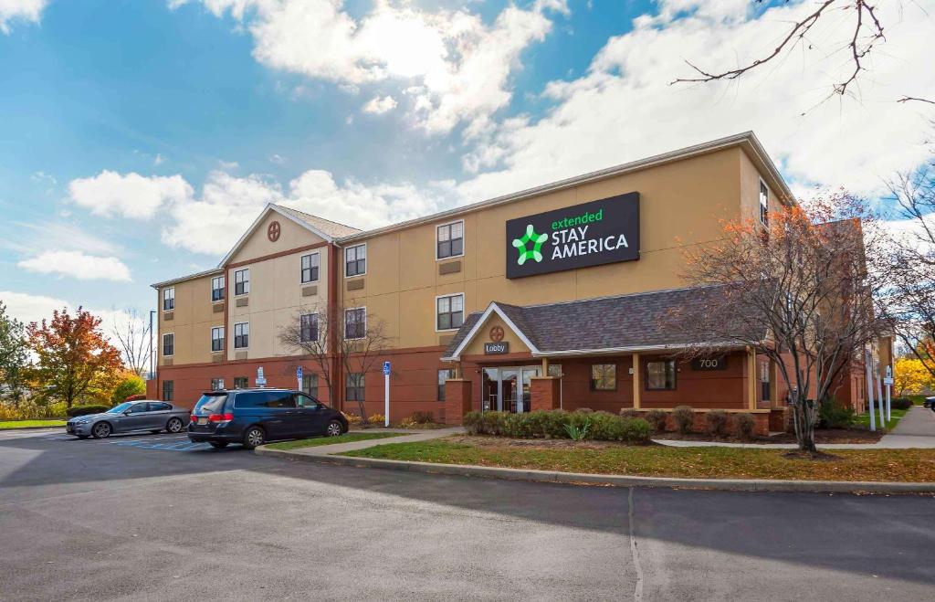 a hotel with a car parked in front of it at Extended Stay America Suites - Rochester - Henrietta in Ridgeland