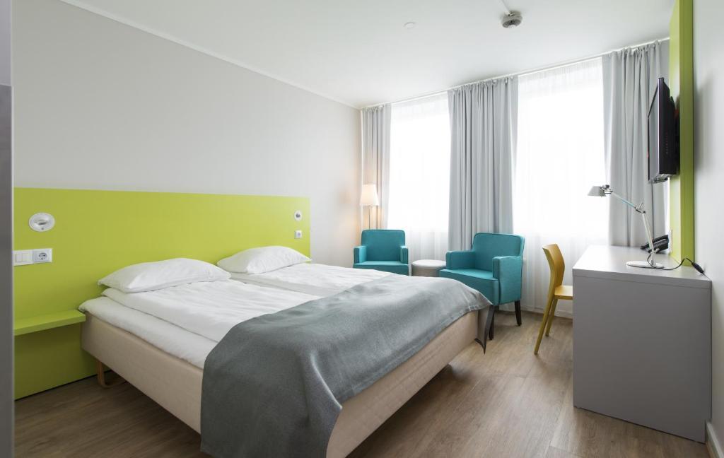 Postel nebo postele na pokoji v ubytování Thon Hotel Trondheim