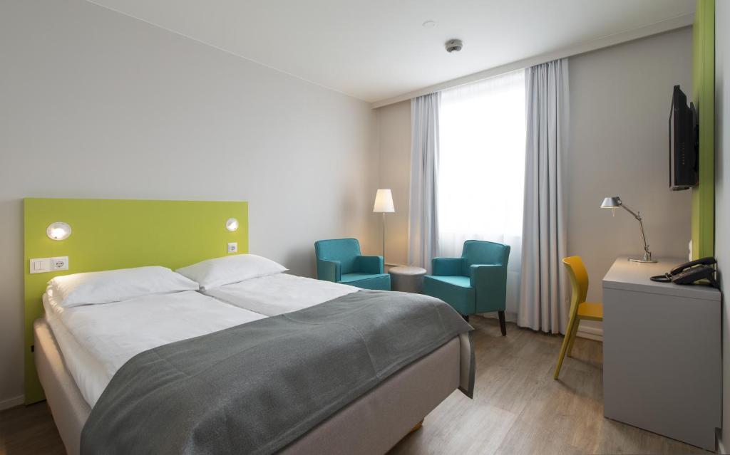 Postel nebo postele na pokoji v ubytování Thon Hotel Trondheim