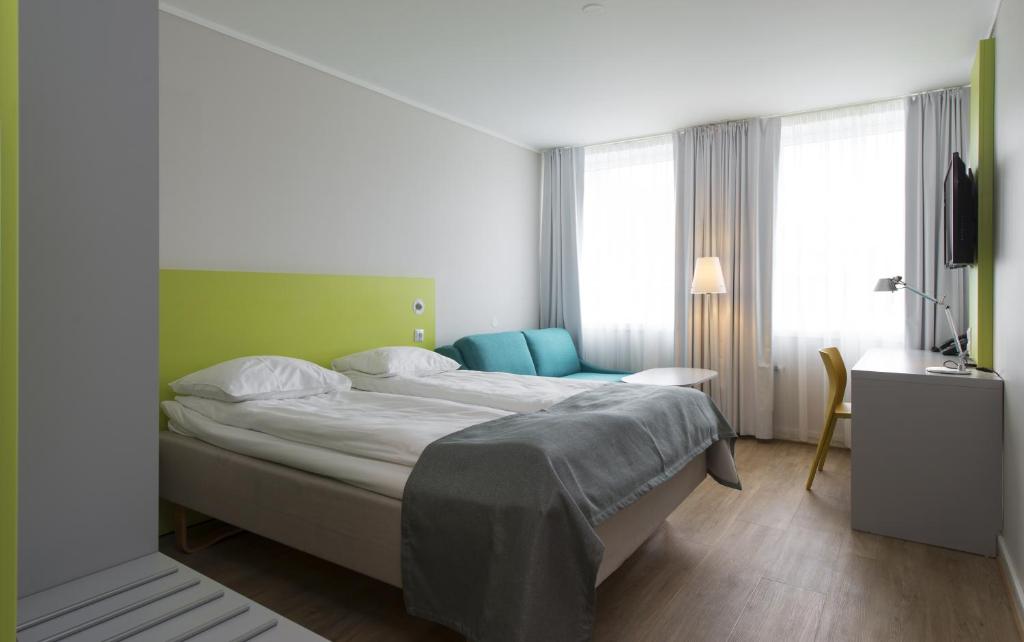 Postel nebo postele na pokoji v ubytování Thon Hotel Trondheim