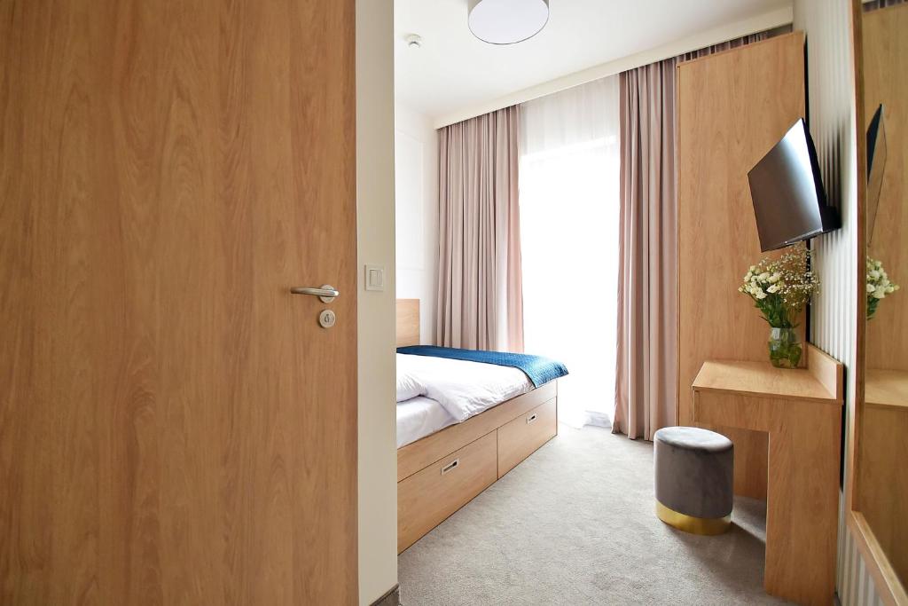Postel nebo postele na pokoji v ubytování IVY Healthy Stay
