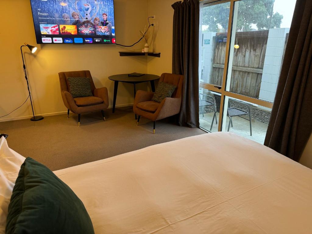 Postel nebo postele na pokoji v ubytování B-Ks Premier Motel Palmerston North