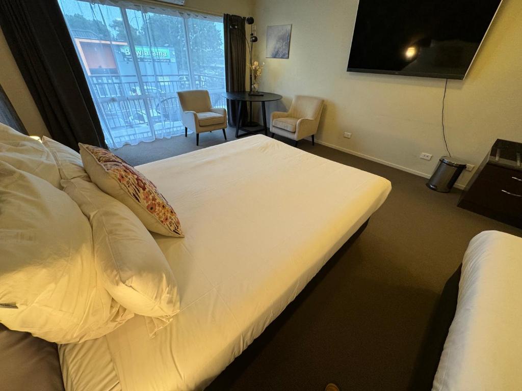 Postel nebo postele na pokoji v ubytování B-Ks Premier Motel Palmerston North