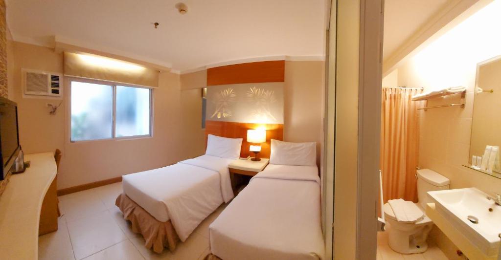 Postel nebo postele na pokoji v ubytování Chalet Baguio