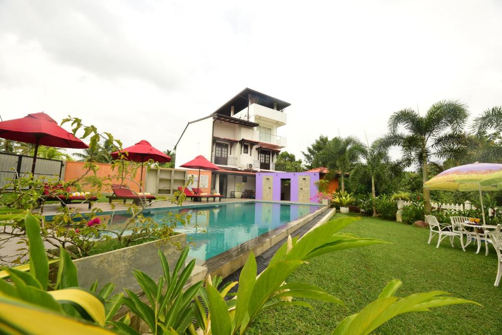 a view of a resort with a swimming pool at Kurulu Villa Baddegama in Galle
