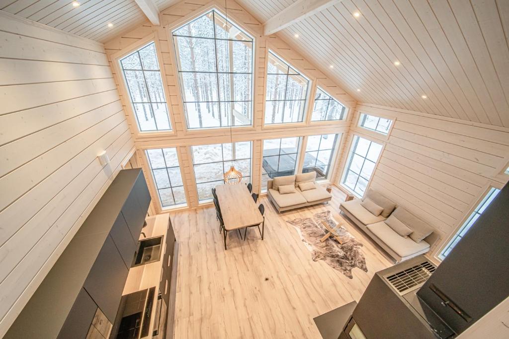 an overhead view of a living room with a large window at Villa Alvo in Kittilä
