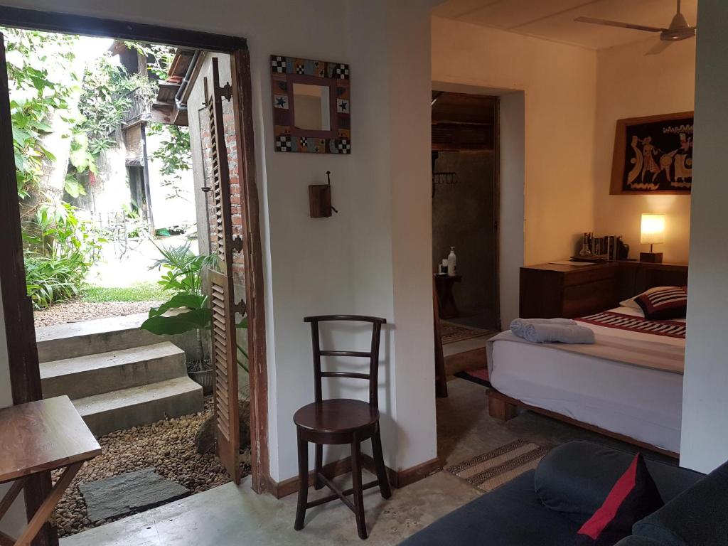 Postel nebo postele na pokoji v ubytování Highbury Colombo