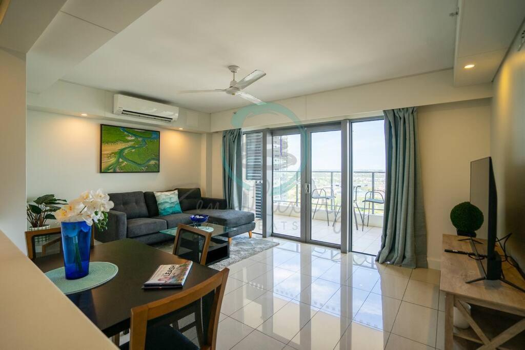 a living room with a couch and a table at Zen Ocean Pebble 1-BR/1-BA Sea View Retreat in Darwin
