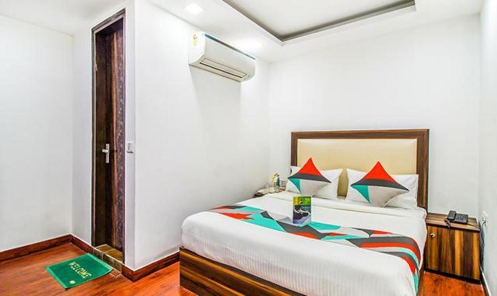 a bedroom with a large bed in a room at Comfy Stay Hotels in New Delhi