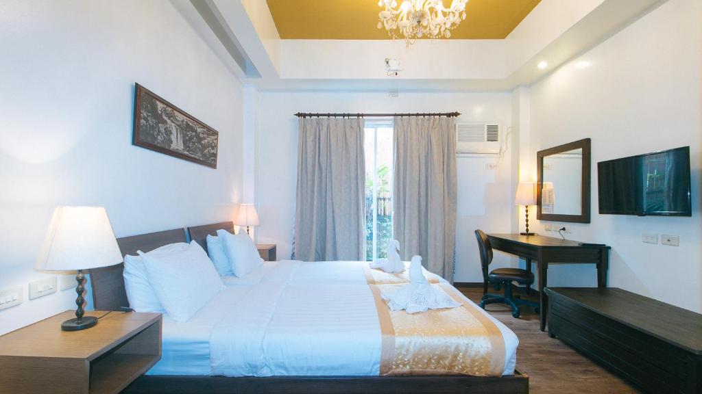 Postel nebo postele na pokoji v ubytování RedDoorz Premium at Anisabel Suites Davao City