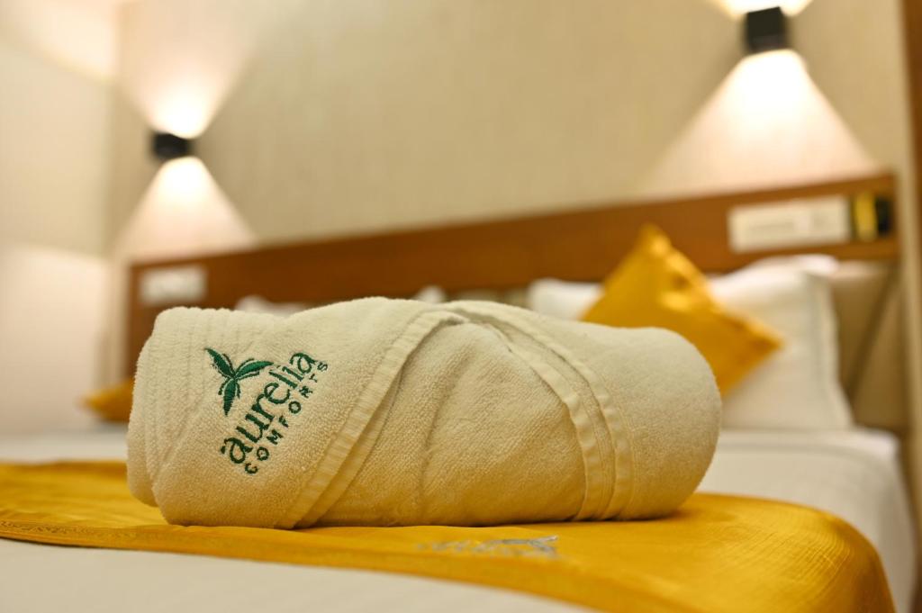 Postel nebo postele na pokoji v ubytování Aurelia Comforts - Deralakatte